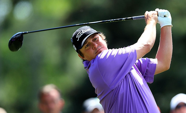 Jason Dufner hits a tee shot on the 18 hole during the second round of the 2012 Masters Tournament at Augusta National.