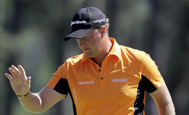 Peter Hanson, of Sweden, waves after his birdie on the eighth green during the third round of the Masters.