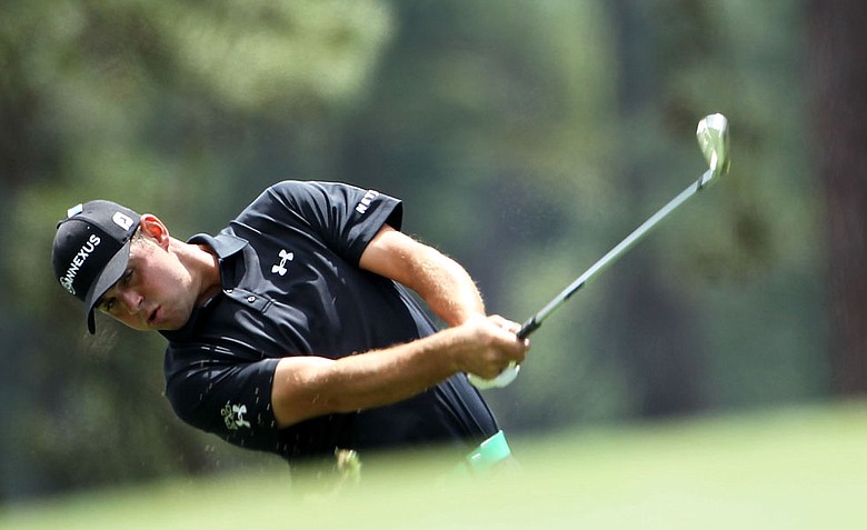 Gary Woodland of the United States hits an approach shot on the first hole during the second round of the 2012 Masters Tournament at Augusta National.