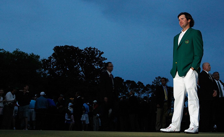 Bubba Watson dons the green jacket after winning the 2012 Masters in a two-hole, sudden-death playoff with Louis Oosthuizen.