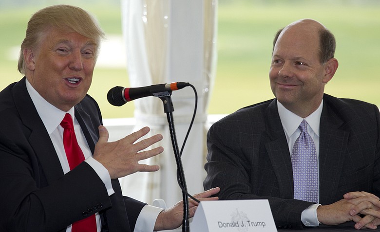Donald Trump, left, and USGA executive director Mike Davis