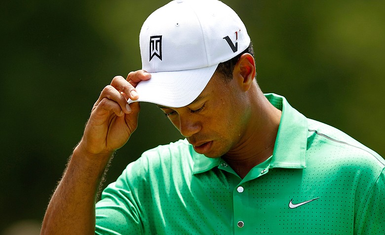 Tiger Woods reacts after putting on the ninth green to finish his second round of the Wells Fargo Championship at the Quail Hollow Club.