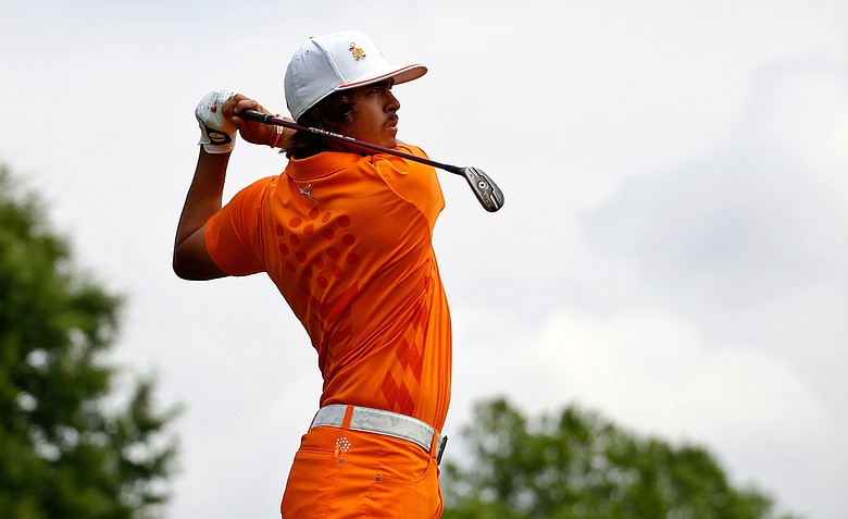 Rickie Fowler hits his tee shot on the first hole during the final round of the Wells Fargo Championship at the Quail Hollow Club.