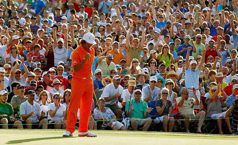 Rickie Fowler celebrates after making a putt for birdie on the first playoff hole to defeat Rory McIlroy and D.A. Points during the final round to win the Wells Fargo Championship at the Quail Hollow Club.