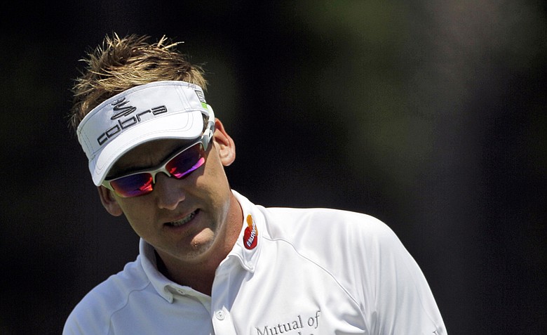 Ian Poulter of England reacts to his shot from the 16th fairway during the first round of the Players Championship.