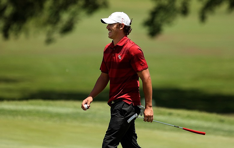 Florida State's Brooks Koepka is all smiles leaving the final hole of the day on Thursday at the NCAA Southwest Regional at Jimmie Austin Oklahoma University GC. Koepka posted a 67.