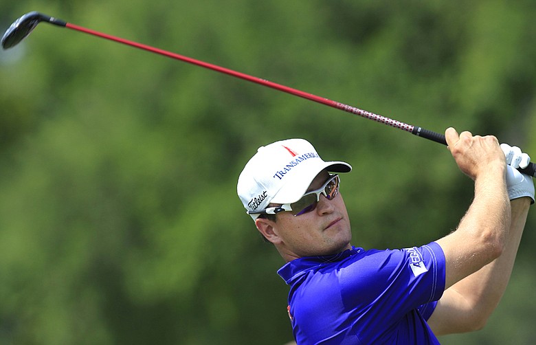 Zach Johnson watches his tee shot on the ninth hole during the first round of the Colonial golf tournament, Thursday, May 24, 2012, in Fort Worth, Texas.