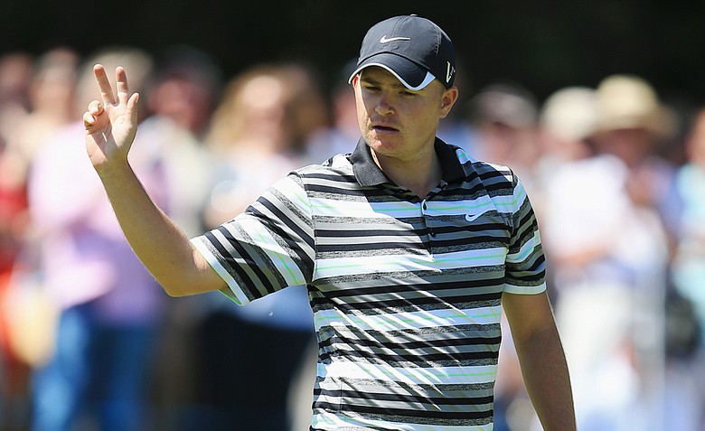 James Morrison acknowledges the crowd after holing an eagle putt on the 18th green during the second round of the BMW PGA Championship on the West Course at Wentworth.