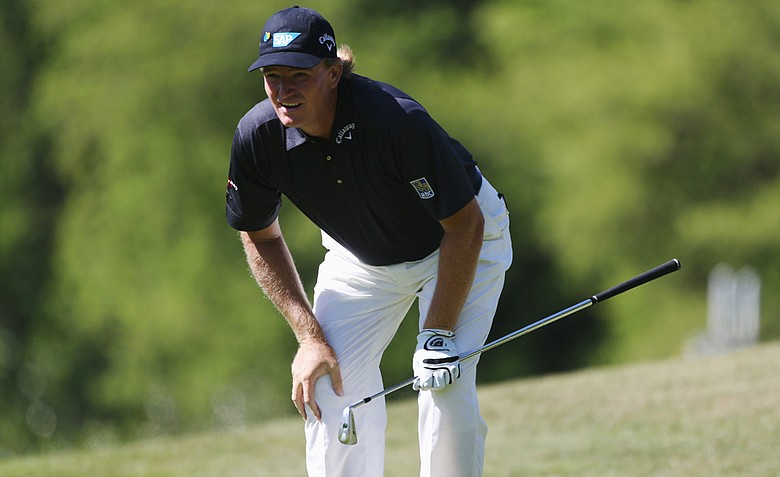 Ernie Els watches his approach shot at the 18th bound off the green and into a greenside bunker, which set him off in post-round interviews at the BMW PGA Championship.