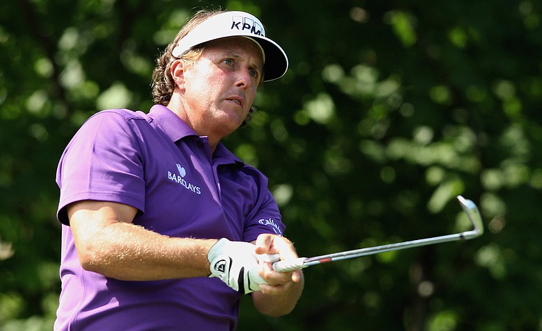 Phil Mickelson watches his tee shot on the 14th hole during the first round of the Memorial Tournament. Mickelson would fire a 7-over 79 and withdraw from the tournament.