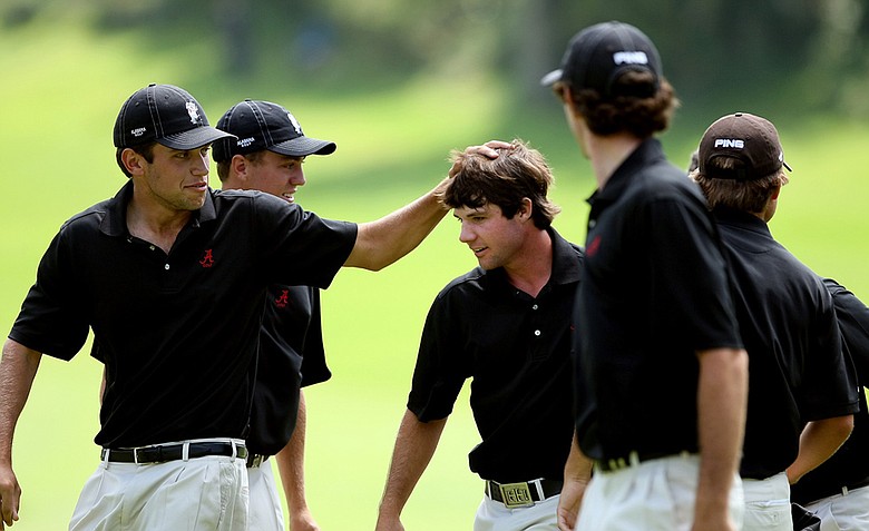 Alabama's Hunter Hamrick is mobbed by his teammates after clinching his match agains California's Joel Stalter during semifinals of Match Play at the 2012 NCAA Championship. Alabama will face Texas in the finals.