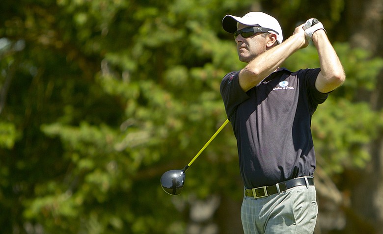 Anthony Summers watches his tee shot on the 11th tee during the 2012 U.S. Open Sectional Qualifying at Village Links of Glen Ellyn in Glen Ellyn, Ill.