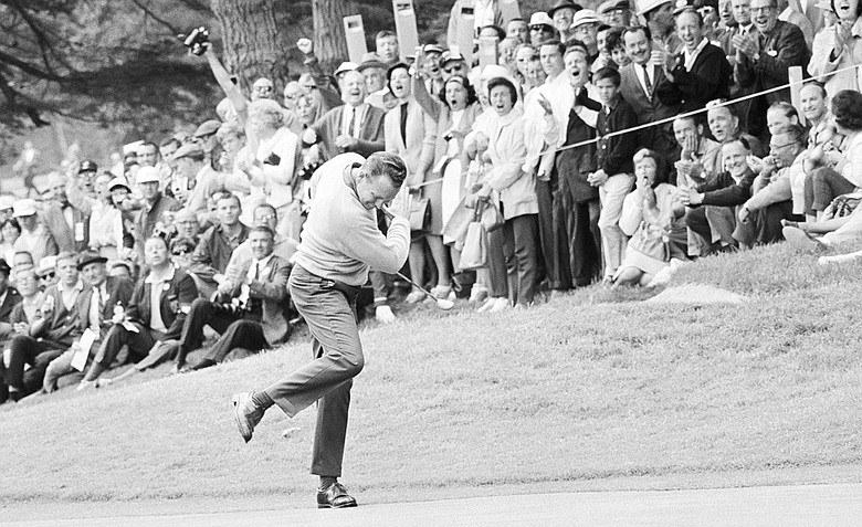 Billy Casper reacts after he ran a 25-foot putt into the cup on the 11th green for a birdie 3 during his playoff with Arnold Palmer for the U.S. Open title in San Francisco, on June 20, 1966. Two strokes down at the time, Casper pulled even when Palmer bogeyed the hole.