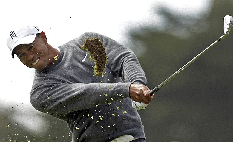 Tiger Woods hits a shot on the 17th hole during the first round of the U.S. Open Championship golf tournament Thursday, June 14, 2012, at The Olympic Club in San Francisco.
