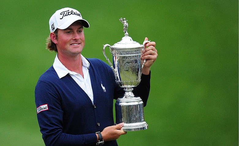 Webb Simpson of the US holds his championship trophy after winning the 112th US Open.