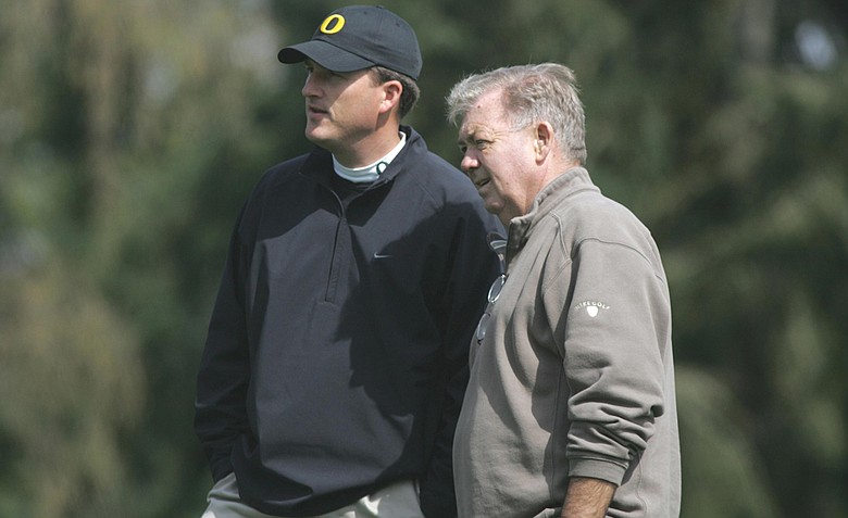 Former Oregon men's golf coach Steve Nosler, right, talks with current Ducks coach Casey Martin. Nosler died July 6, 2012 at the age of 74.