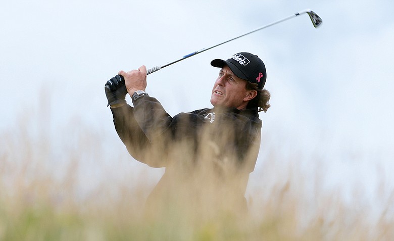 Phil Mickelson hits his tee shot on the 11th hole during the first round of the 141st Open Championship at Royal Lytham & St. Annes Golf Club.