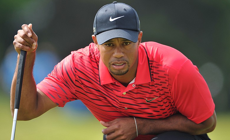 Tiger Woods lines up a putt on the second green during the final round of the 141st Open Championship at Royal Lytham & St. Annes Golf Club.