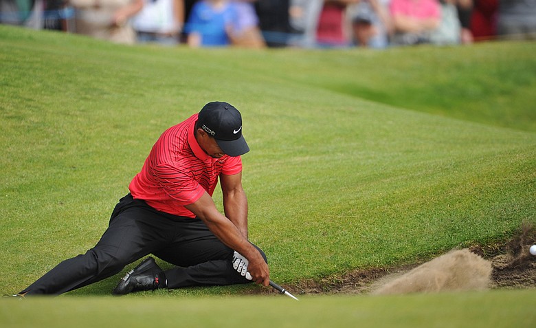 Tiger Woods watches a bunker shot on the sixth hole during the final round of the 141st Open Championship at Royal Lytham & St. Annes Golf Club.