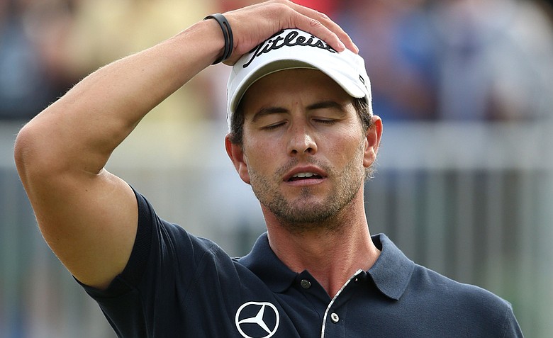 Adam Scott reacts to a missed par putt on the 18th green during the final round of the 141st Open Championship at Royal Lytham & St. Annes Golf Club.