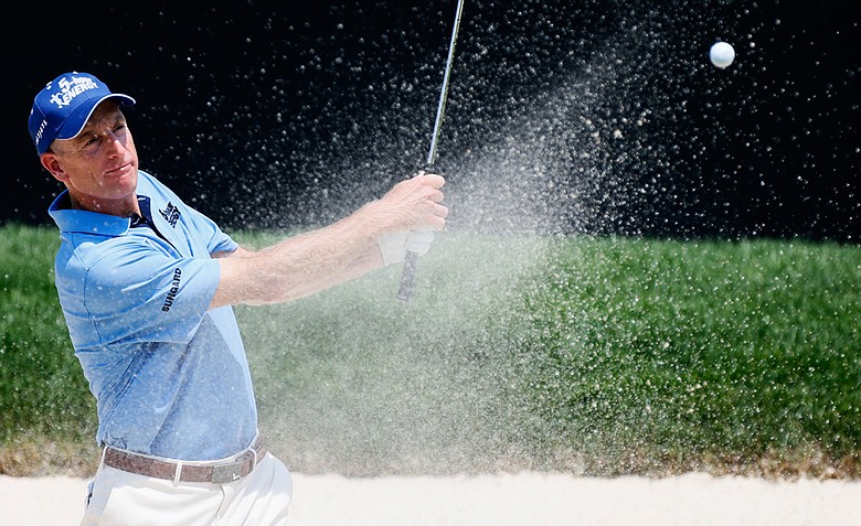 Jim Furyk plays a shot from the sand trap on the 18th hole during the second round of the World Golf Championships-Bridgestone Invitational at Firestone Country Club.