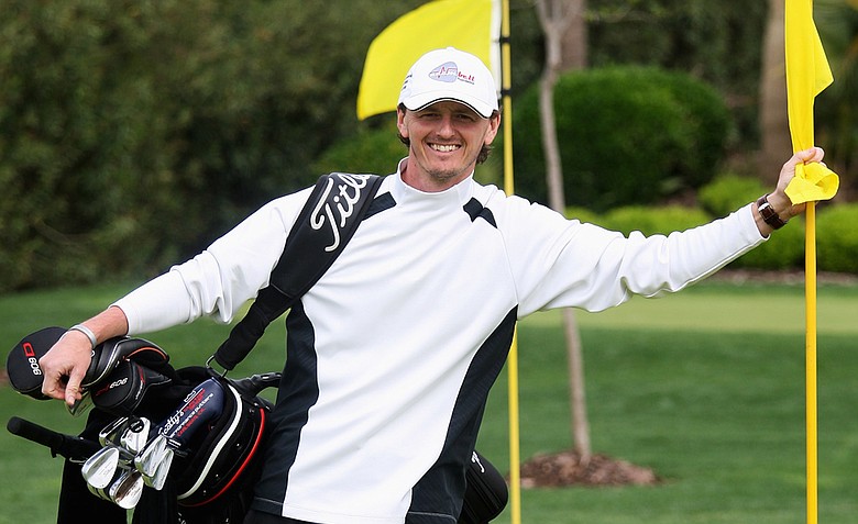 Former European Tour golfer Warren Bennett of England poses as a caddie during the third round of the Open de Andalucia in 2009.