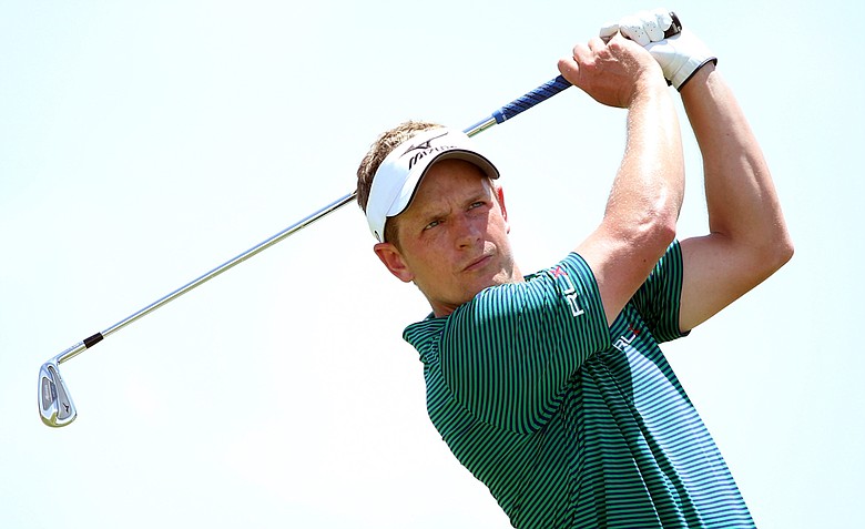 Luke Donald hits an iron shot during a practice round of the 2012 PGA Championship at the Ocean Course.