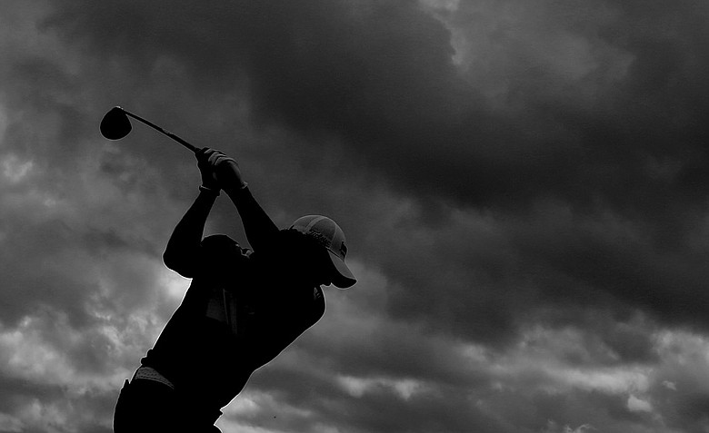 Rory McIlroy plays through dark clouds as storms entered the area during a Tuesday practice round at the Ocean Course.
