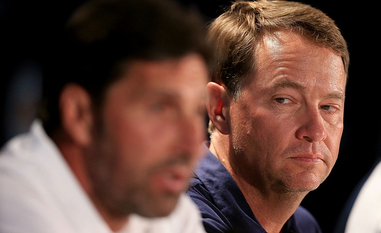 U.S. Ryder Cup captain Davis Love III looks on as European Ryder Cup captain Jose Maria Olazabal speaks during a practice round of the 94th PGA Championship at the Ocean Course.