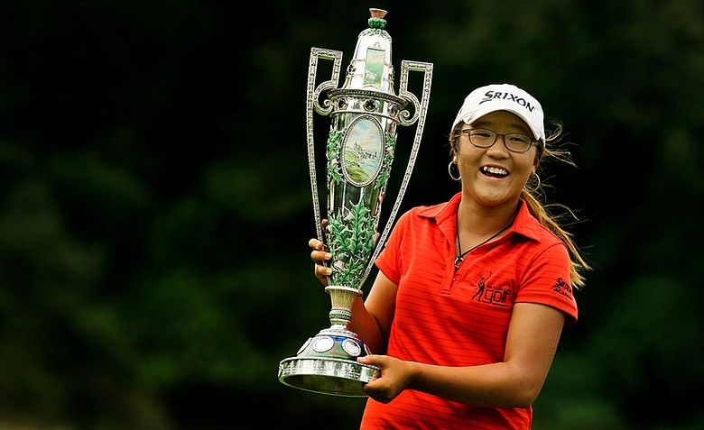 Lydia Ko poses with The Robert Cox Trophy after defeating Jaye Marie Green 3&1 during the finals at the 112th U. S. Women's Amateur Championship at The Country Club in Cleveland.