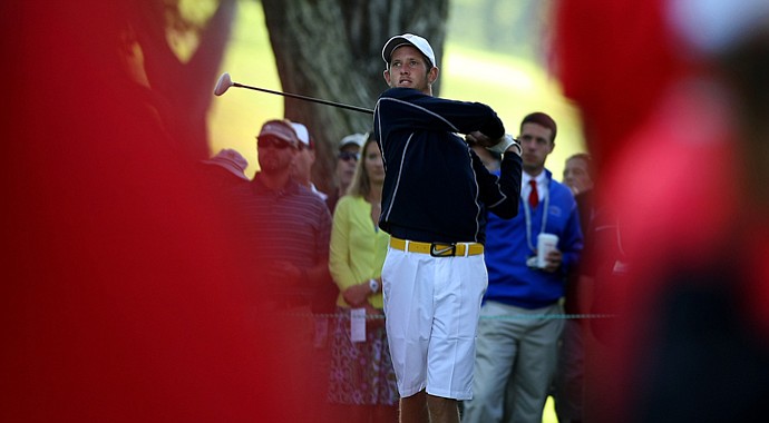 Steven Fox is framed by the spectators as he tees of during the morning round of final of the 112th U. S. Amateur Championship at Cherry Hills Country Club in Cherry Hills Village, Colo.