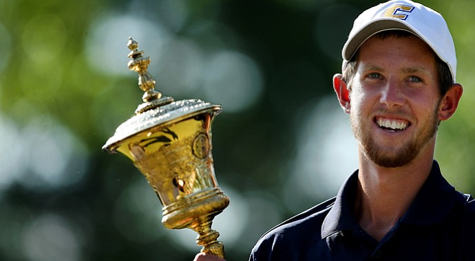 Steven Fox holds the Havemeyer Trophy after deafeating Michael Weaver on the 37th hole of the 112th U. S. Amateur Championship at Cherry Hills Country Club in Cherry Hills Village, Colo.
