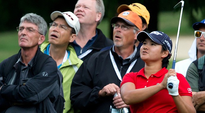 Yani Tseng watches as her second shot hits a tree and lands in the rough on the first hole during the first round of the LPGA Tour's Canadian Women's Open.