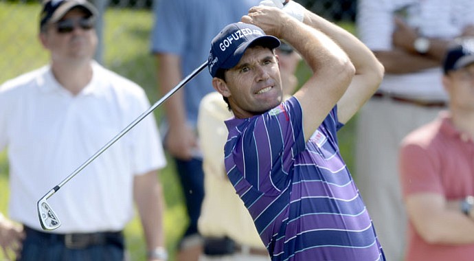 Padraig Harrington fired a 7-under 64 to tie the course record at Bethpage Black on Thursday.