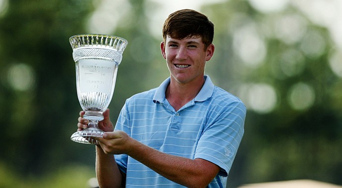 Robby Shelton IV poses with his trophy after winning the TPC Junior Players at TPC Sawgrass The Players Stadium. Shelton won by a shot over Brad Dalke.