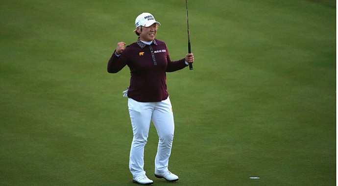 Jiyai Shin celebrates holing her final putt for victory on the 18th green during the final round of the Ricoh Women's British Open at Royal Liverpool Golf Club.