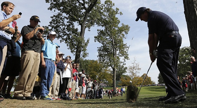 USA's Phil Mickelson hits out of the rough on the fourth hole on Tuesday.