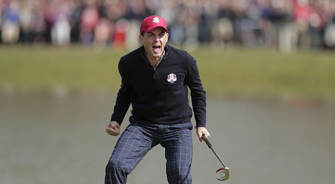 USA's Keegan Bradley celebrates after winning their foursomes match on the 15th hole at the Ryder Cup Friday, Sept. 28, 2012, at the Medinah Country Club in Medinah, Ill.