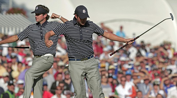 USA's Webb Simpson, right, and Bubba Watson react after Simpson made a putt to with the 13th hole during a four-ball match at the Ryder Cup Saturday, Sept. 29, 2012, at the Medinah Country Club in Medinah, Ill.