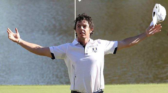 Rory McIlroy of Europe waves to the gallery on the 17th green after winning his match against Keegan Bradley.