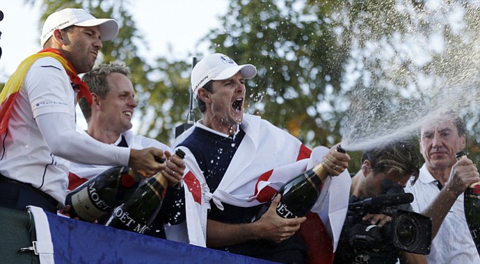 Europe's Sergio Garcia, left to right, Luke Donald and Justin Rose celebrate after winning the Ryder Cup PGA golf tournament Sunday, Sept. 30, 2012, at the Medinah Country Club in Medinah, Ill.