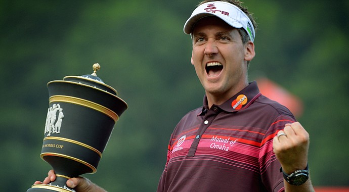 Ian Poulter celebrates with the trophy after winning the WGC-HSBC Champions tournament held on the Olazabal Course at the Mission Hill Golf Club.