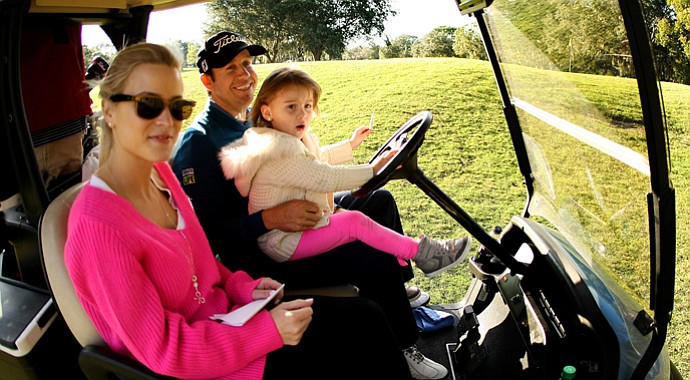 PGA Tour player Erik Compton with his daughter, Petra, 3 1/2, and wife Barbara during the PGA Tour Father/Child Tournament on the Oak Trail Course.