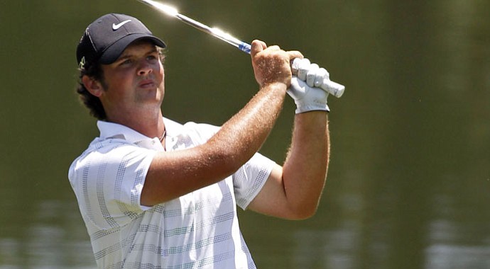Patrick Reed hits to the 15th green during the first round of the Wells Fargo Championship.