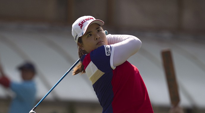 South Korea's Inbee Park watches her shot after she tees off on the first hole during the third day of the LPGA Lorena Ochoa Invitational at the Guadalajara Country Club in Guadalajara, Mexico.