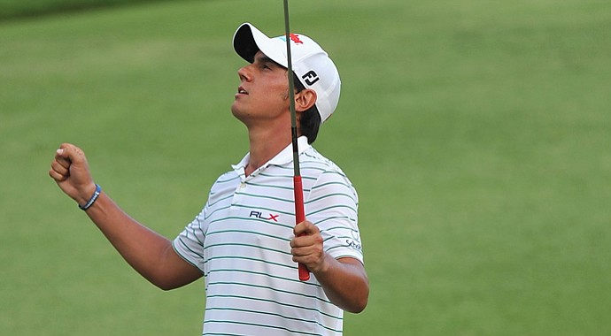 Matteo Manassero celebrates holing his eagle putt during the third playoff hole after the final round of the Barclays Singapore Open.