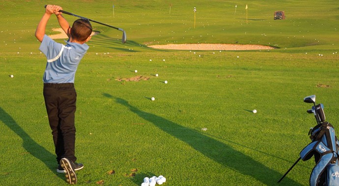 Itai Cohen, 7, swings for the fences at Caesarea Golf Club.
