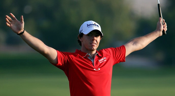 Rory McIlroy celebrates after winning the DP World Tour Championship on the 18th green.