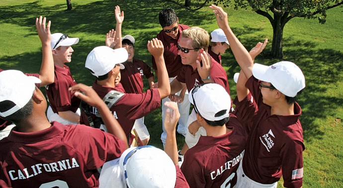 Captain Andy Nisbet (center) and coach Tony Guerrero rally the California team.