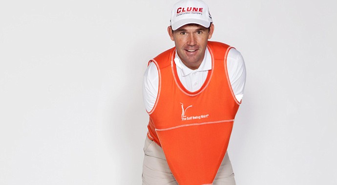 Padraig Harrington shows off the Golf Swing Shirt, a practice device that helps connectivity during a golfer's swing.